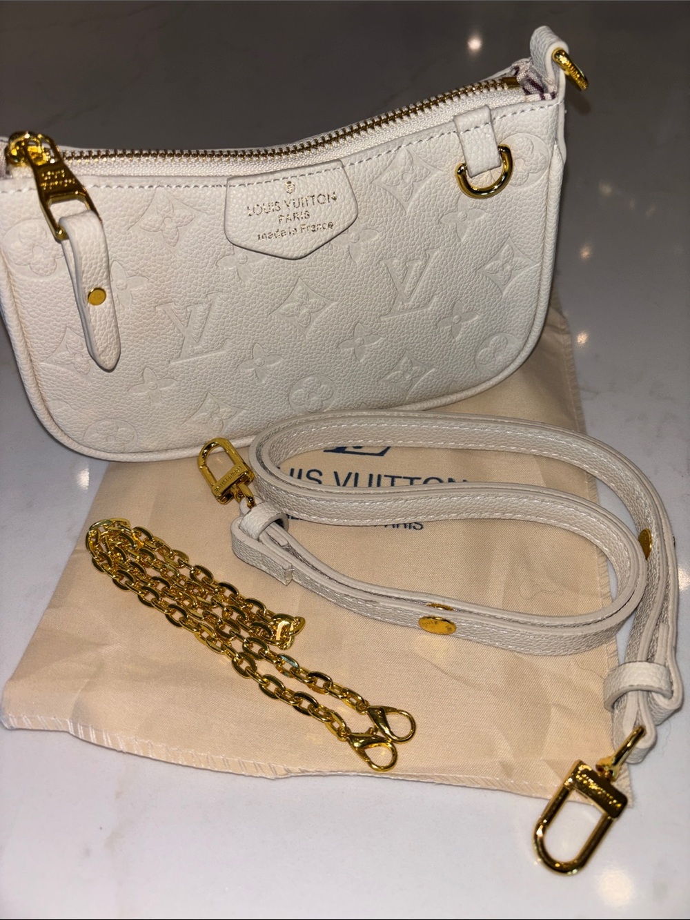White Monogram Empreinte Mini Pochette with Gold Hardware